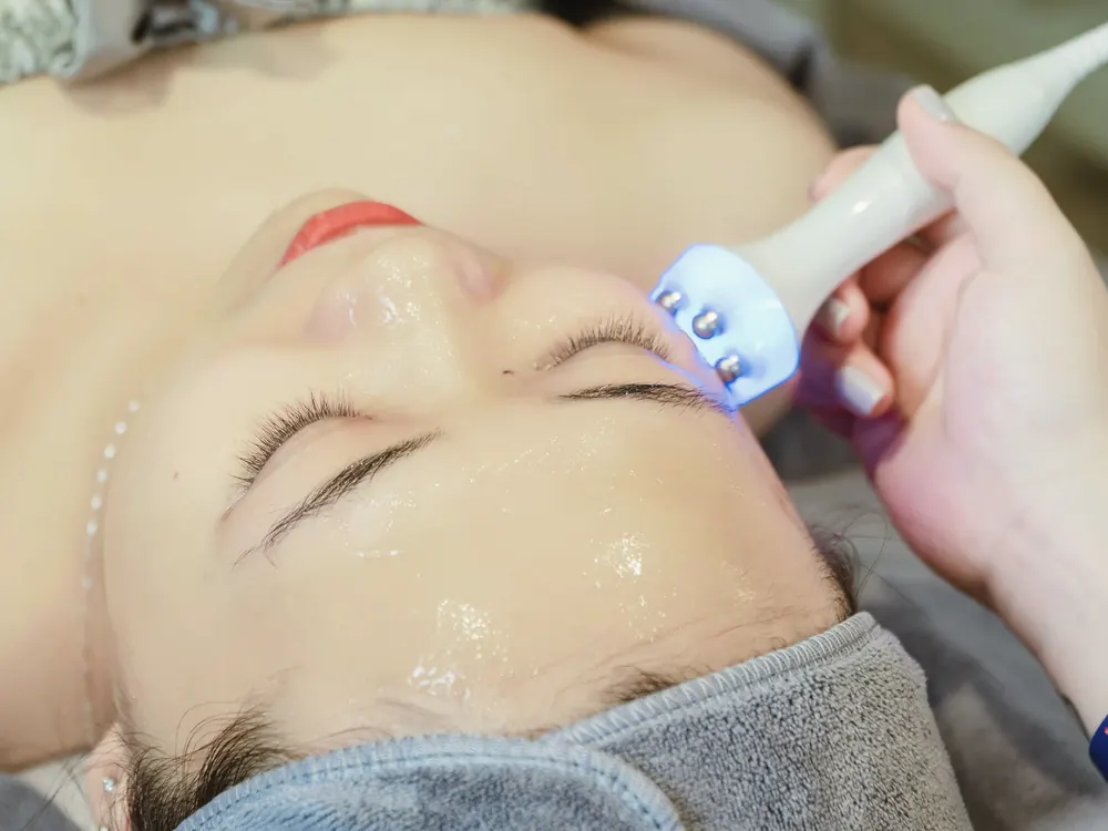 HydraFacial device on hydrated, glowing skin