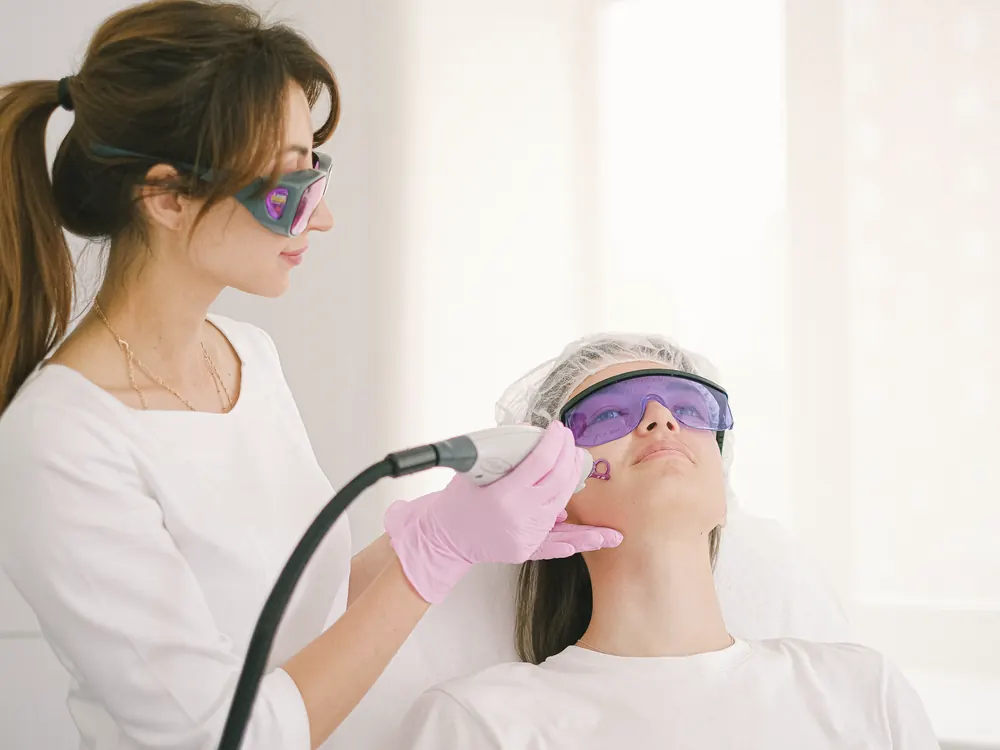Laser facial treatment with protective eyewear